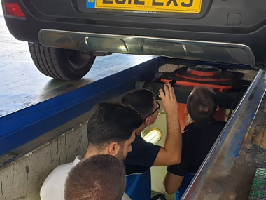 Inspectors check suspension on Peugeot 3008